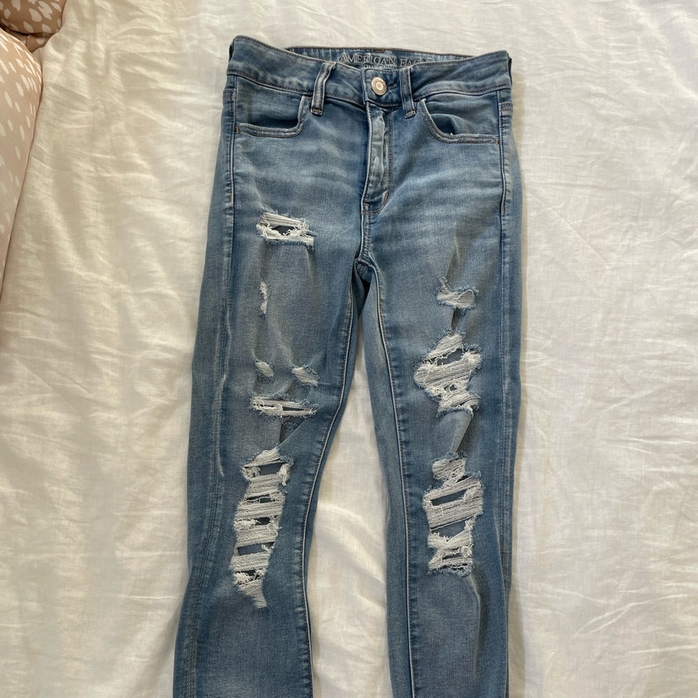 High waisted distressed jeans